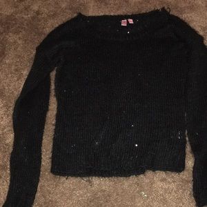 A black sweater with sequins
